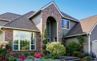 Mississauga house featuring vinyl windows and decorative arch above main entry.