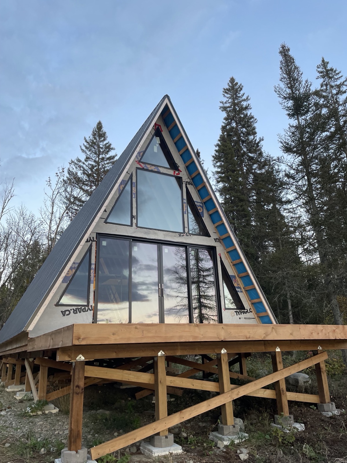A frame home with a full height window wall installed by Optima Windows and Doors in the Greater Toronto Area