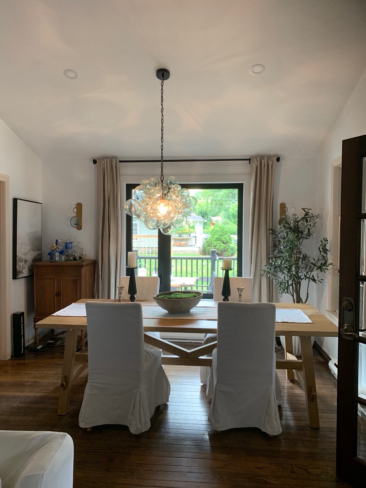 Dining area with new black framed windows installed by Optima Windows and Doors in the Greater Toronto Area