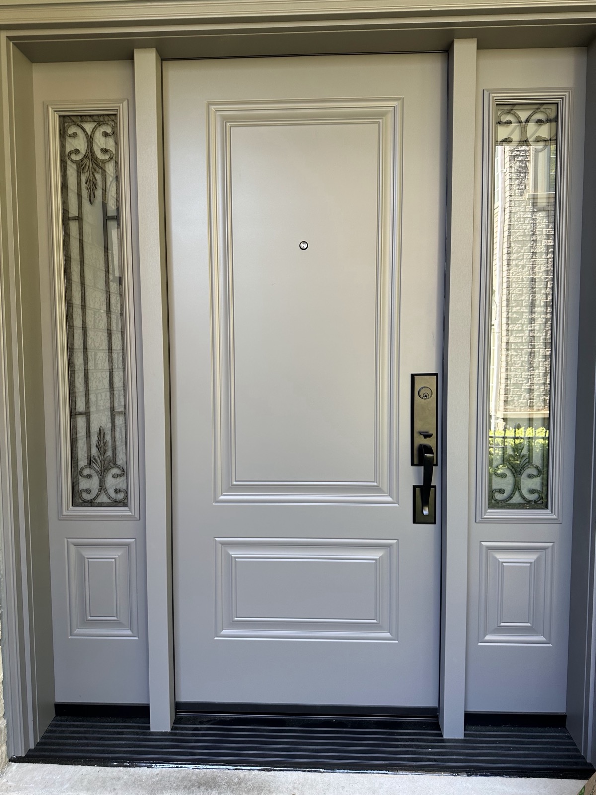 Double entry doors with decorative glass seen from inside installed by Optima Windows and Doors in the Greater Toronto Area