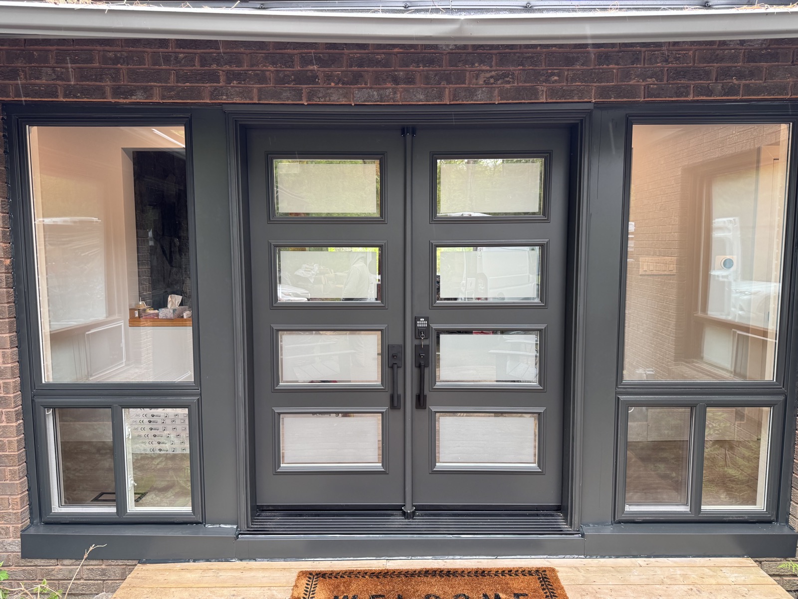 Entry door with sidelites seen from inside the home installed by Optima Windows and Doors in the Greater Toronto Area