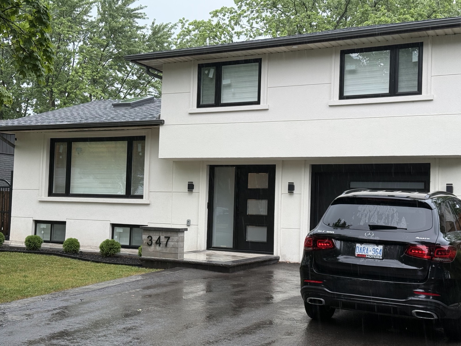 Modern two storey home with black framed windows installed by Optima Windows and Doors in the Greater Toronto Area