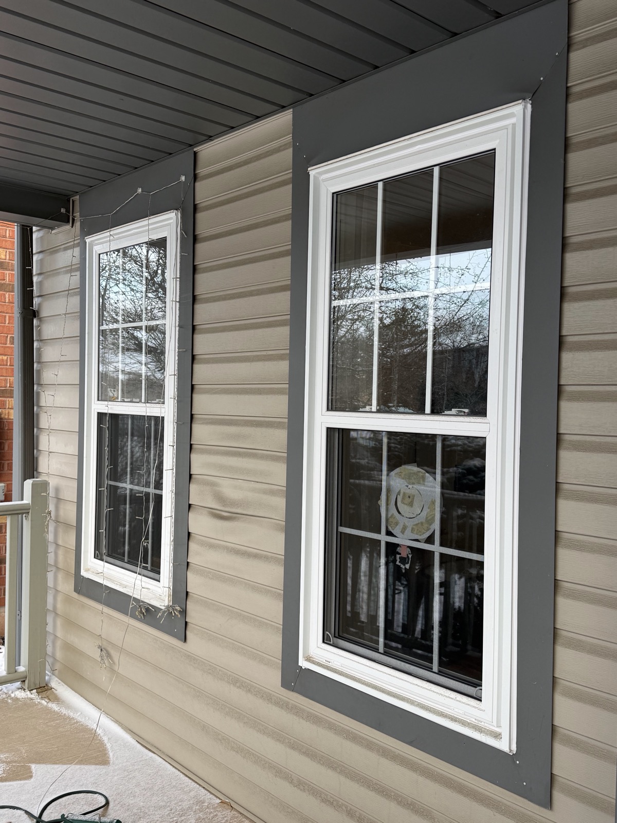 White replacement window on siding installed by Optima Windows and Doors in the Greater Toronto Area