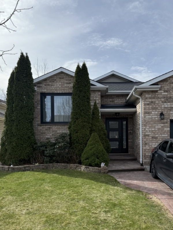 Brick to brick window replacement, black frames in Niagara Falls, Ontario by Optima Windows and Doors, photo from Andreea Bujilov's 5-star Google review